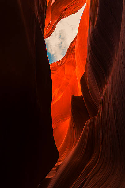 istock Abstract rock formations carved by water and light in a desert canyon 2243477572