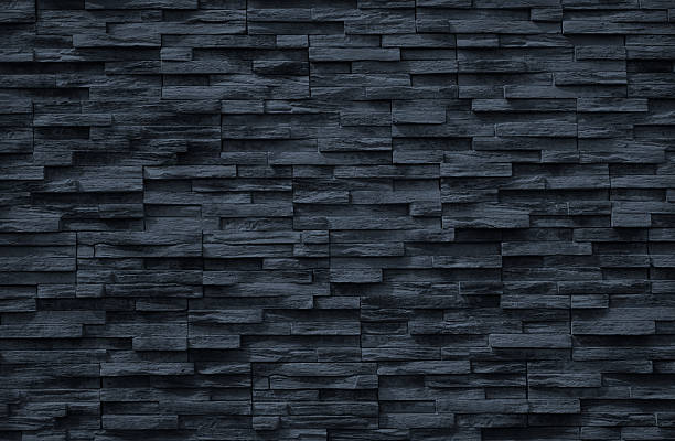 istock Black dark dusty blue gray background. Stone wall surface texture. Close-up. Exterior. Empty blank template design. 2243478929