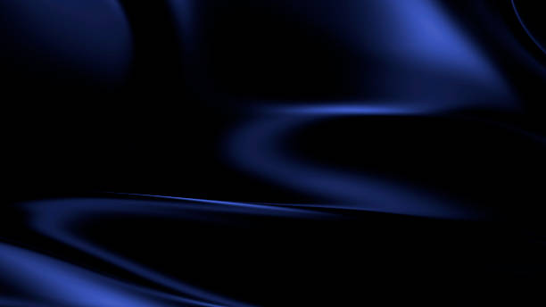istock Dark blue liquid metal fabric texture with soft reflections and smooth flowing satin folds forming luxury abstract surface background with elegant metallic depth 2243479596
