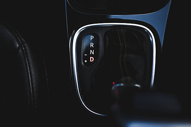 Car's automatic gear selector glowing with the d for drive engaged