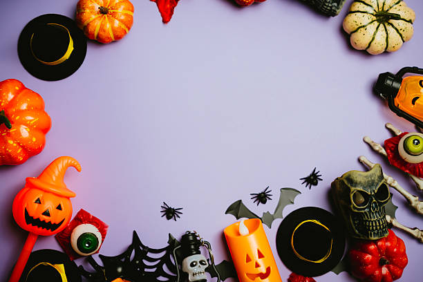 istock Halloween themed decorations and props arranged in a circular layout on a purple background for spooky celebrations and parties 2243484852