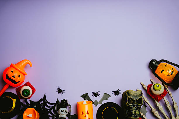 istock Colorful Halloween Decorations with Spooky Elements on a Purple Background for Party or Festival Themes 2243484970