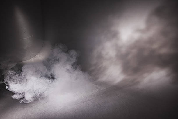 istock Clouds of smoke on gray background. Rays of light on white background 2243486914