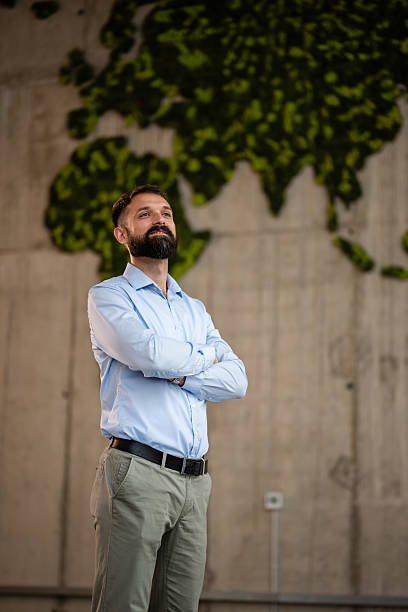 istock Confident businessman looking at global sustainability future 2243489287
