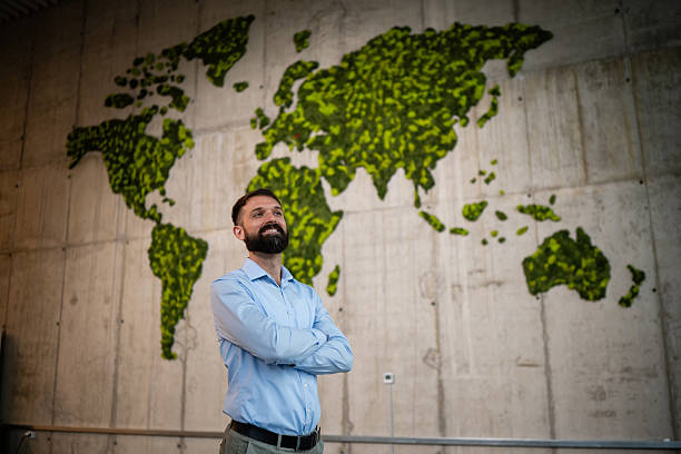 istock Businessman embracing global sustainability in eco office 2243489371