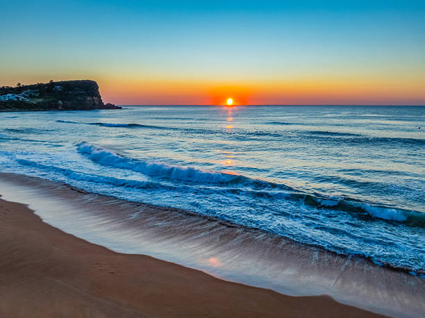 Blush Horizon: Sunrise by the Sea