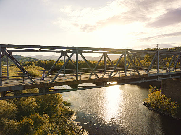 istock Active Lifestyle. Woman Running On Urban Bridge 2243493319