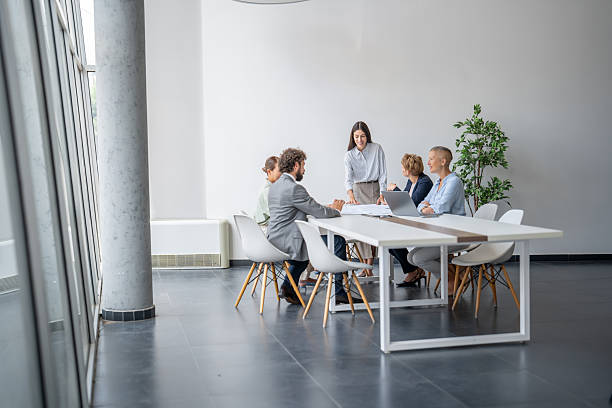 istock Business team discussing new project during meeting in modern office 2243493364