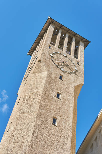 Tall Clock Tower Against a Bright Blue Sky in Northern European Style Architecture