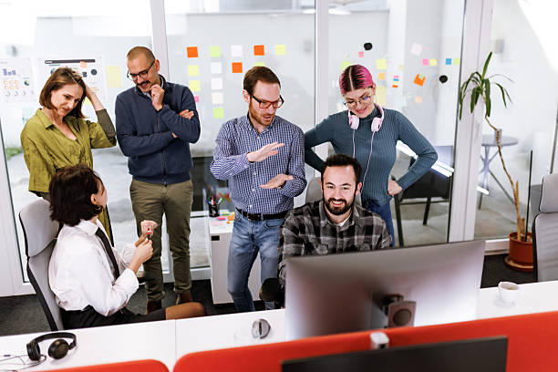 istock Business team collaborating in a modern office space, discussing strategies and engaging with each other in a productive work environment 2243493923