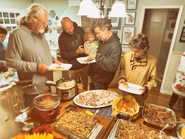 Family with toddler and teenagers gather for Thanksgiving