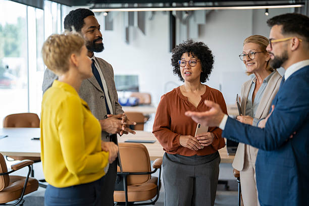 istock Business people talking during informal meeting in modern office 2243495365
