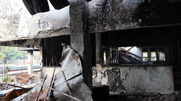 istock Burnt building stands in ruins after fire, showing destruction and damage 2243503871