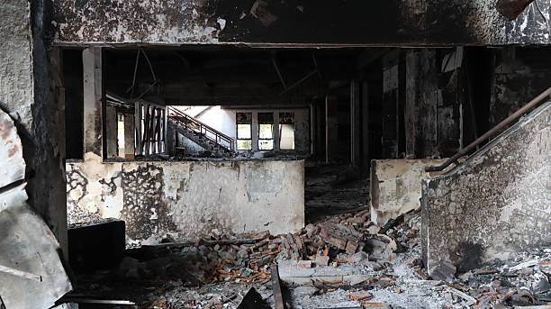 istock Burnt building stands in ruins after fire, showing destruction and damage 2243503872