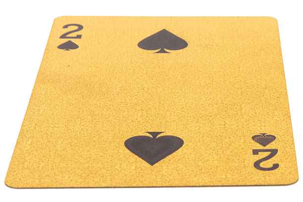 2 two spades card gambling color gold isolated on white background.