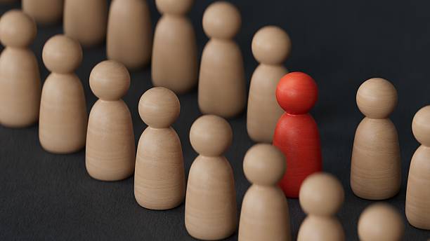 istock Stand out from the crowd. Individuality, originality and uniqueness.3D rendering on black background. 2243510196