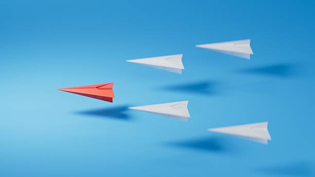 istock Different business concept.new ideas. paper art style. creative idea.Leaderplane concept, red paper plane leading among white.3D rendering on blue background. 2243510201