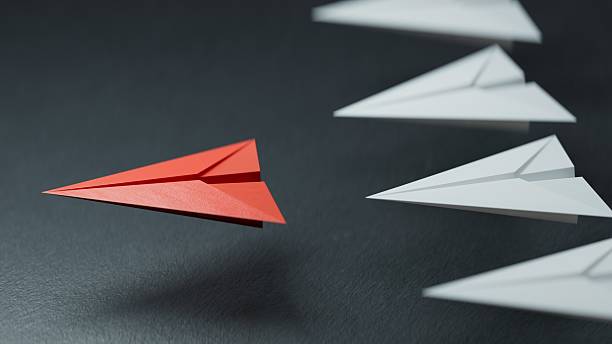 istock Different business concept.new ideas. paper art style. creative idea.Leaderplane concept, black leader plane leading white planes.3D rendering on black background. 2243510214