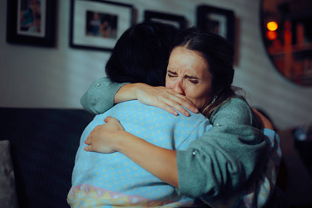 istock Sad Woman Crying Hugging her Mother Feeling Depressed 2243511765