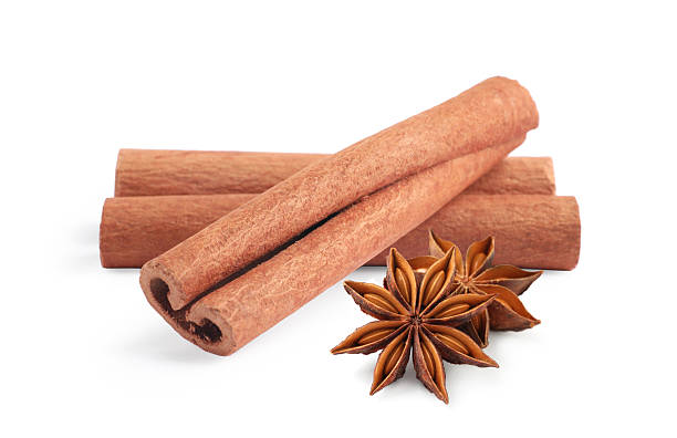 istock Aromatic cinnamon sticks and anise stars isolated on white 2243512057