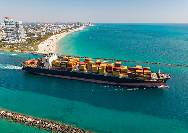 istock Cargo ship in sea, aerial view. Freight container loaded on cargo vessel. Aerial cargo ship with container. Cargo business. Container ship. Shipping logistics. Commercial shipping 2243517000