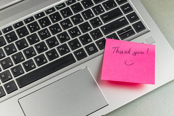 istock Thank you note on laptop keyboard indicating appreciation for help 2243520626