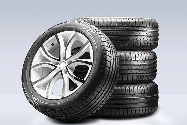 istock A stack of summer tires and alloy wheels neatly arranged for easy access, showcasing their design and providing excellent braking performance in dry weather. set of summer wheels on a gray background. 2243528385