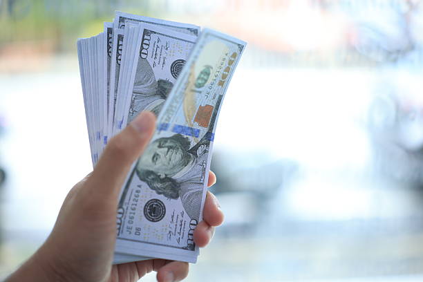 istock Money in hand 2243529296