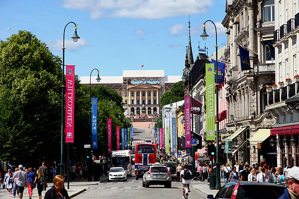 Oslo, Norway - 27 Jun 2012: Some people and cars on Karl Johans Street, Oslo, Norway