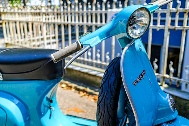Munich, Germany - July 19:typical italian Vespa Motorscooter (build from Piaggio) at a street in munich on July 19, 2024