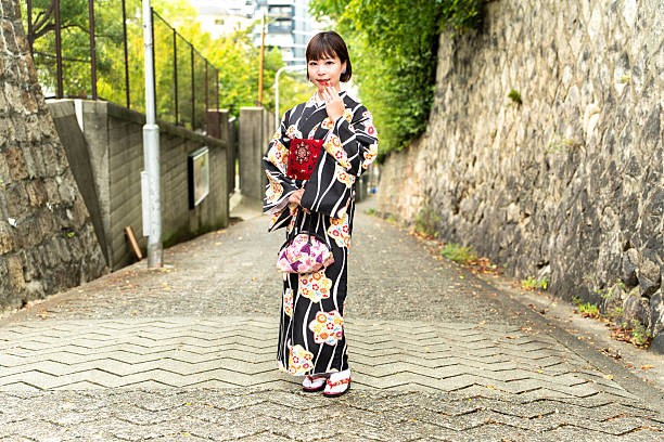 istock A Japanese woman standing on a slope called Aizenzaka 2243535062
