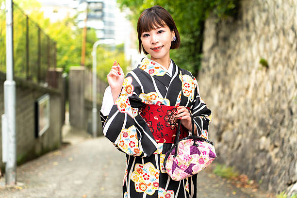 istock A Japanese woman standing on a slope called Aizenzaka 2243535077