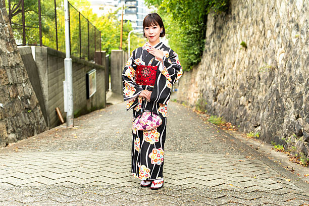 istock A Japanese woman standing on a slope called Aizenzaka 2243535300