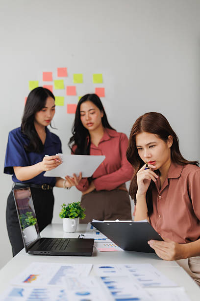 istock Asian businesswomen working together in modern office 2243536595
