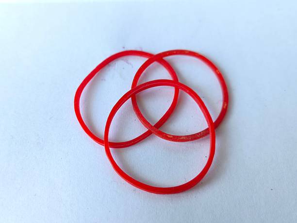 istock Red and yellow rubber bands used to tie packages 2243537002