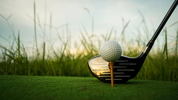 istock Golf ball on green grass in the evening golf course with sunshine background. 2243537606