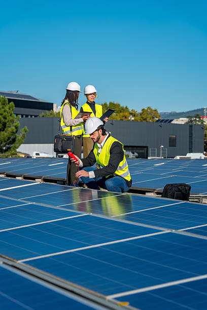 istock Engineers inspecting rooftop solar panels for renewable energy 2243537648