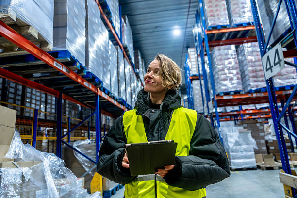 istock Woman working in cold storage warehouse managing inventory with tablet 2243538024