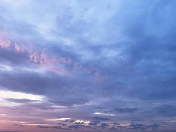 istock Twilight pink and purple sunset sky with soft and smooth clouds background. Evening sunset clouds sky wallpaper. 2243538083