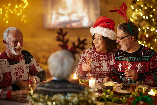 istock Happy senior couples talking during lunch on New Year's at home. 2243538086
