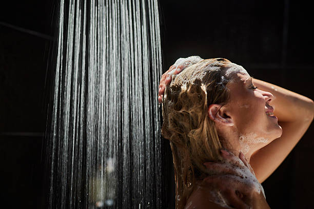 istock Washing hair under the shower! 2243540350