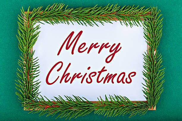 Merry Christmas. Festive holiday greeting card featuring vibrant green pine branches surrounding joyful message, creating warm and inviting atmosphere perfect for celebrating holiday season