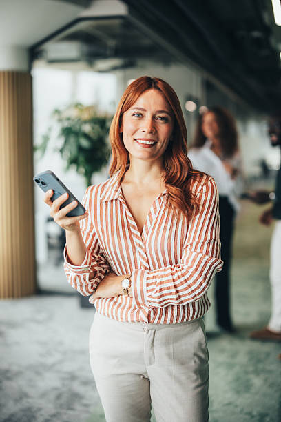 istock Elegant businesswoman using her phone 2243544991