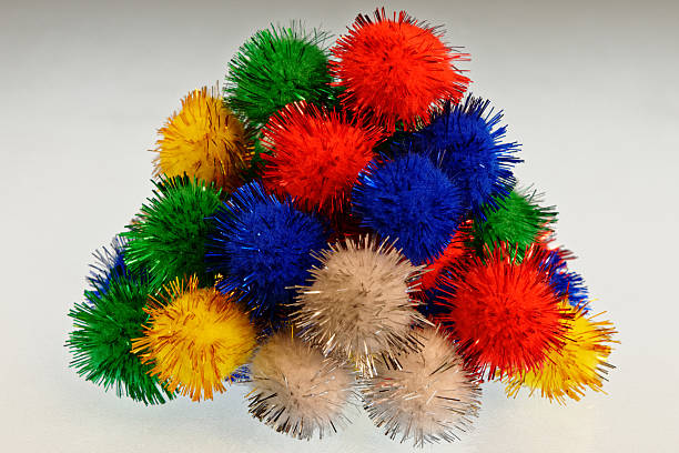 istock Colourful pom poms in a pile 2243545283