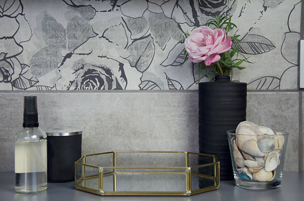istock Modern bathroom decor with black vase, pink flower and seashells 2243545752