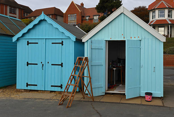 Felixstowe, Suffolk, England -  October 16, 2025: Beach Huts with Open Door and Step ladder