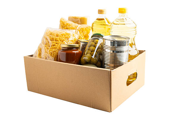 istock Foodstuffs in donation box isolated on white background with clipping path. 2243546265