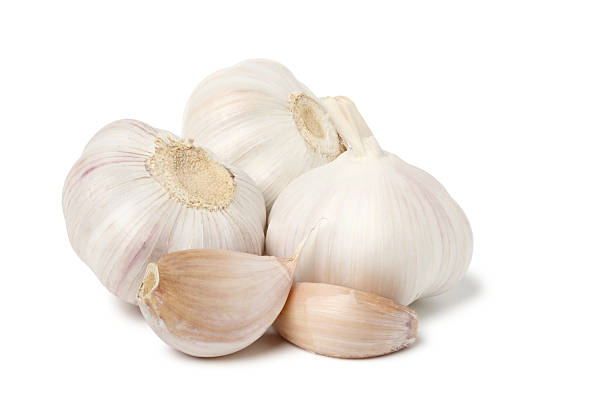 istock Garlic peeled and whole garlic bulbs. 2243547562
