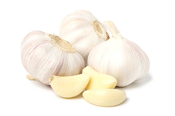 istock Garlic peeled and whole garlic bulbs. 2243547573