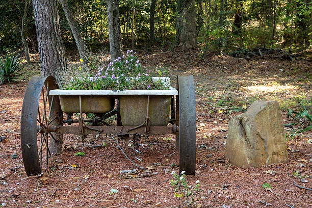 Leonardtown, Maryland USA An old cart of the side of the road with a flower pot.